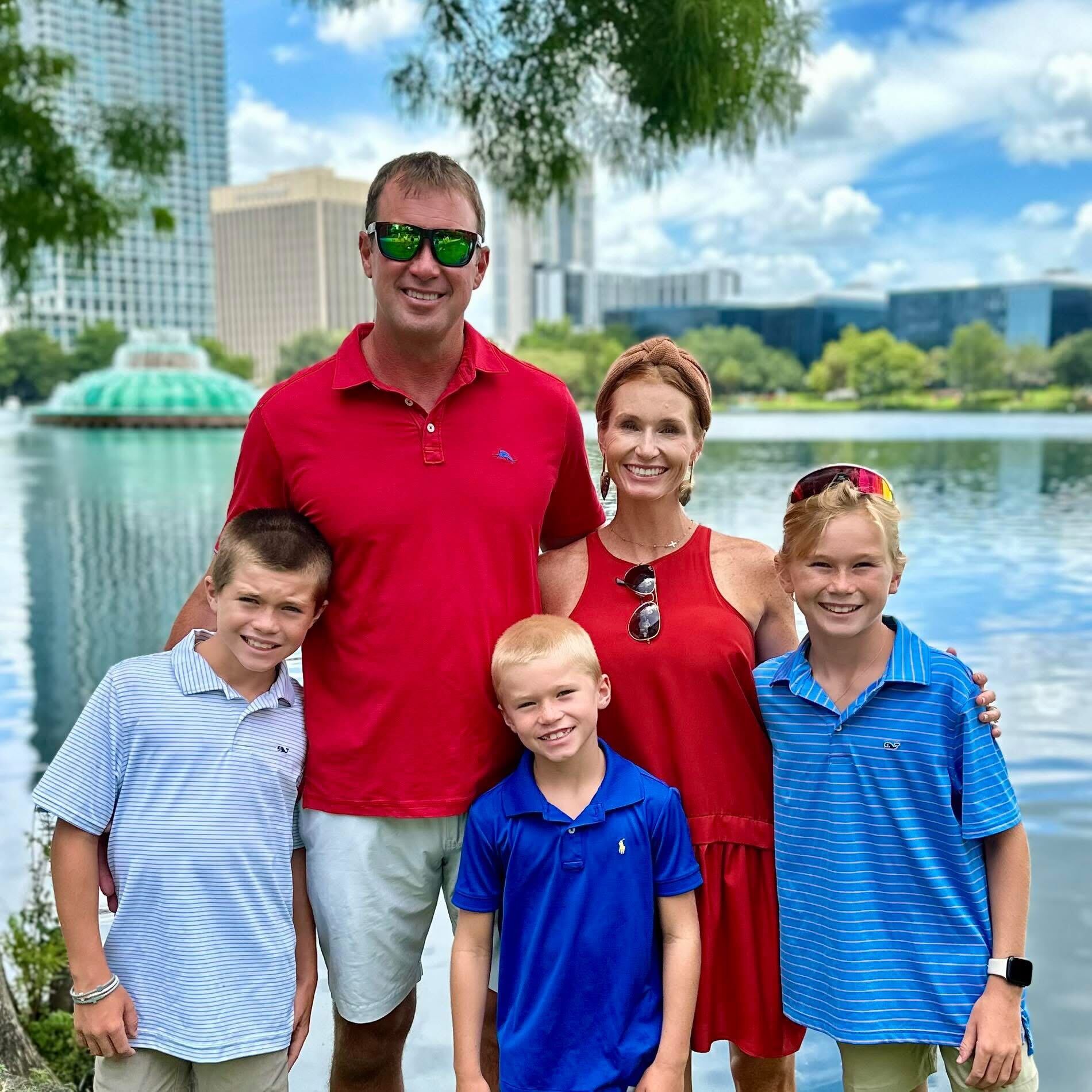 Coach Jason with his family by the lake in downtown Orlando